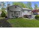 Charming two-story home featuring manicured front yard with healthy lawn and mature tree at 5543 N Pennsylvania N St, Indianapolis, IN 46220