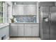 Kitchen featuring stylish stainless steel refrigerator and backsplash at 5543 N Pennsylvania N St, Indianapolis, IN 46220