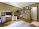 This office features hardwood floors, a desk, and shelves at 5543 N Pennsylvania N St, Indianapolis, IN 46220