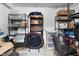 Organized storage area with shelving units, boxes and assorted items, maximizing space in a small room at 5543 N Pennsylvania N St, Indianapolis, IN 46220