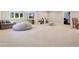 Spacious carpeted basement with entertainment area, game area, and large windows at 5572 Harness Dr, Greenwood, IN 46143
