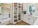 Bright pantry with floor to ceiling shelves, white cabinetry, and a sink, and plenty of storage space at 5572 Harness Dr, Greenwood, IN 46143