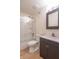 Bathroom with shower-tub, vanity with modern sink, and updated fixtures at 5602 Northport Dr, Indianapolis, IN 46221