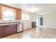 Spacious kitchen with stainless steel appliances and tile flooring, plus outdoor access at 5602 Northport Dr, Indianapolis, IN 46221