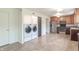 Combination kitchen laundry area featuring new appliances and ample storage at 5602 Northport Dr, Indianapolis, IN 46221