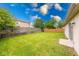 A green backyard with wood privacy fence at 5633 Fox Glove Ln, Indianapolis, IN 46254