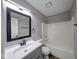Updated bathroom features modern fixtures and a shower-tub combination at 5633 Fox Glove Ln, Indianapolis, IN 46254