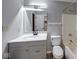 This updated bathroom features modern fixtures and a shower-tub combination at 5633 Fox Glove Ln, Indianapolis, IN 46254
