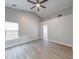 Spacious bedroom boasts vaulted ceilings, wood-look floors, and a connected bathroom at 5633 Fox Glove Ln, Indianapolis, IN 46254