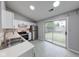 Updated kitchen features stainless steel appliances and a sliding door to the backyard at 5633 Fox Glove Ln, Indianapolis, IN 46254
