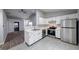 Updated kitchen featuring stainless steel appliances, white cabinets, and modern fixtures at 5633 Fox Glove Ln, Indianapolis, IN 46254