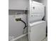 This laundry room features a stackable washer and dryer for space saving at 5633 Fox Glove Ln, Indianapolis, IN 46254