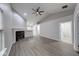 Bright living room featuring neutral paint, modern ceiling fan, and wood-look floors at 5633 Fox Glove Ln, Indianapolis, IN 46254