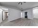 Spacious living room with wood-look floors, neutral paint, and vaulted ceiling at 5633 Fox Glove Ln, Indianapolis, IN 46254