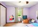 Bedroom featuring a gray bean bag chair, wood storage chest, and a window for natural light at 564 Penright Ct, Indianapolis, IN 46217
