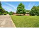 This single Gathering home has a long driveway and a large manicured lawn at 564 Penright Ct, Indianapolis, IN 46217