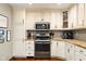 Kitchen featuring white cabinets, stainless steel appliances, and quartz countertops at 564 Penright Ct, Indianapolis, IN 46217