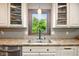 The sink features a picture window over looking the back yard at 564 Penright Ct, Indianapolis, IN 46217