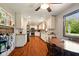 Kitchen featuring hardwood floors, white cabinets, stainless steel appliances, and eat in nook at 564 Penright Ct, Indianapolis, IN 46217