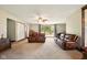 Open living room with comfortable leather seating and natural light throughout at 564 Penright Ct, Indianapolis, IN 46217