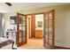 Bedroom with french doors leading to the bathroom and a view of the bathroom at 564 Penright Ct, Indianapolis, IN 46217