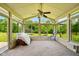 Sun room with lots of light from all the windows featuring neutral carpet and ceiling fan at 564 Penright Ct, Indianapolis, IN 46217