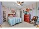 Cozy bedroom with a ceiling fan, wood accents, and bright decor at 5737 Arlington Dr, Plainfield, IN 46168