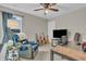 Bedroom featuring a fan, desk, chair, and guitars at 5737 Arlington Dr, Plainfield, IN 46168
