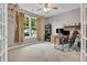 Bright and airy bedroom featuring neutral tones, a large window, and a functional desk area at 5737 Arlington Dr, Plainfield, IN 46168
