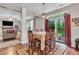 Cozy dining room featuring a large table with seating for six and backyard views at 5737 Arlington Dr, Plainfield, IN 46168