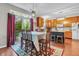 Inviting dining area with backyard views, with stylish light fixture and easy access to the kitchen at 5737 Arlington Dr, Plainfield, IN 46168