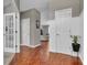 Inviting foyer with beautiful hardwood floors and a view into the living room at 5737 Arlington Dr, Plainfield, IN 46168