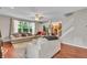 Spacious living room with hardwood floors, neutral tones, and an open layout to the staircase at 5737 Arlington Dr, Plainfield, IN 46168