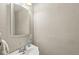 Clean half bathroom featuring a white sink and decorative mirror at 5889 W Homestead Dr, Frankton, IN 46044
