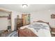 Comfortable bedroom with wooden furniture, a decorative quilt, and a convenient closet at 5889 W Homestead Dr, Frankton, IN 46044