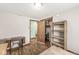Bedroom features classic Singer sewing machine, wood shelving, and closet access at 5889 W Homestead Dr, Frankton, IN 46044