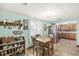 Cozy dining area with wooden table, chairs, and decorative shelving at 5889 W Homestead Dr, Frankton, IN 46044