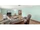 Comfortable living room featuring hardwood floors, plush seating, and neutral wall color at 5889 W Homestead Dr, Frankton, IN 46044