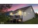 View of a home's backyard featuring a deck with furniture and a well-manicured lawn at 589 Viking Warrior Blvd, Westfield, IN 46074