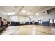Indoor basketball court with hardwood flooring, high ceilings, and natural light from windows, providing a spacious area at 589 Viking Warrior Blvd, Westfield, IN 46074