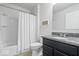 Bright bathroom featuring a shower-tub combination, white tile, and granite countertops at 589 Viking Warrior Blvd, Westfield, IN 46074