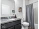 Well-lit bathroom featuring a vanity with granite countertops and a combination shower and tub with a curtain at 589 Viking Warrior Blvd, Westfield, IN 46074