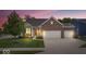 Charming brick home with a two-car garage, lush lawn, and inviting front porch at 589 Viking Warrior Blvd, Westfield, IN 46074