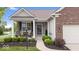 Inviting front porch featuring comfortable seating, beautiful landscaping, and a cozy entrance at 589 Viking Warrior Blvd, Westfield, IN 46074