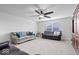 Large living room with plush carpeting, a ceiling fan, and plenty of space for furniture and activities at 589 Viking Warrior Blvd, Westfield, IN 46074