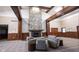 Cozy lounge area with a stone fireplace and comfortable seating, perfect for relaxation and socializing at 589 Viking Warrior Blvd, Westfield, IN 46074