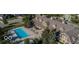 A stunning aerial view of a community pool, lounge area, and clubhouse with classic architectural details at 589 Viking Warrior Blvd, Westfield, IN 46074