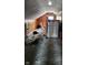 Unfinished attic space with slanted ceilings and carpet at 621 E 31St St, Anderson, IN 46016