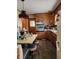 Vintage style kitchen with warm wood cabinets, matching table and retro accents at 621 E 31St St, Anderson, IN 46016