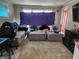 Inviting living room with plush seating and carpet at 621 E 31St St, Anderson, IN 46016